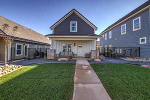View of front facade featuring board and batten siding and a porch