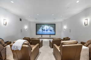 Cinema featuring recessed lighting and light carpet