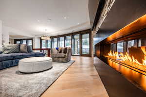Living room with recessed lighting and light wood finished floors