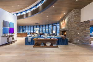 Common area with expansive windows, recessed lighting, and a high wood ceiling