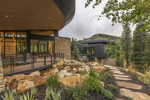 Exterior space featuring stone siding