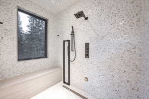 Bathroom featuring tiled shower