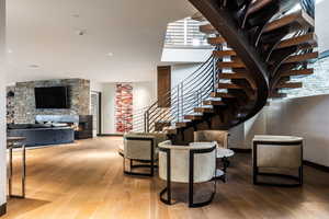 Staircase featuring wood-type flooring and baseboards