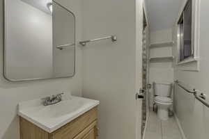 Bathroom featuring vanity and light tile patterned floors