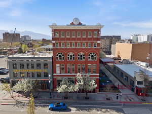 View of building exterior with a city view and a mountain view