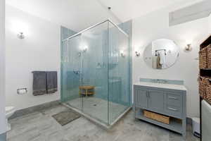 Full bath featuring vanity and a shower stall