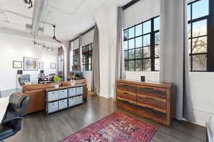 Office featuring dark wood-style flooring
