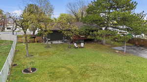 Fenced backyard featuring a wooden deck
