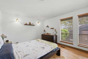 Bedroom featuring baseboards and light wood-style flooring