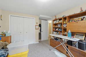 Office space featuring light carpet and baseboards