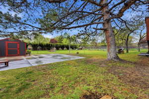 View of yard featuring a storage shed