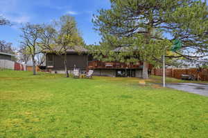 Back of house with a wooden deck