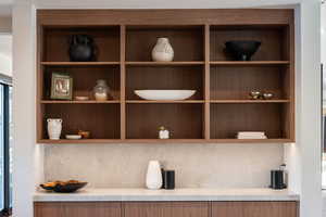 Detailed view of light countertops and backsplash