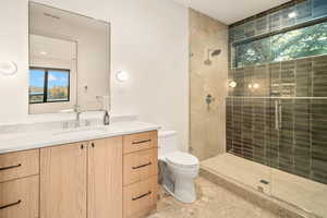 Full bath with plenty of natural light, a shower stall, and vanity