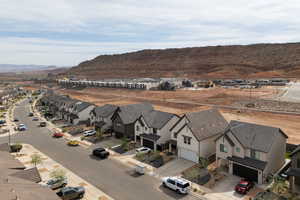 Aerial perspective of suburban area featuring a mountain backdrop