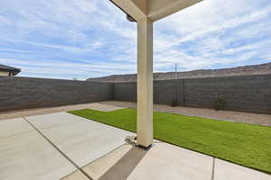 Fenced backyard featuring a patio