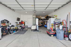 Garage with freestanding refrigerator