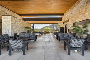 View of patio featuring outdoor seating and a mountain view