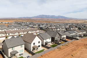 Aerial perspective of suburban area with a mountain backdrop