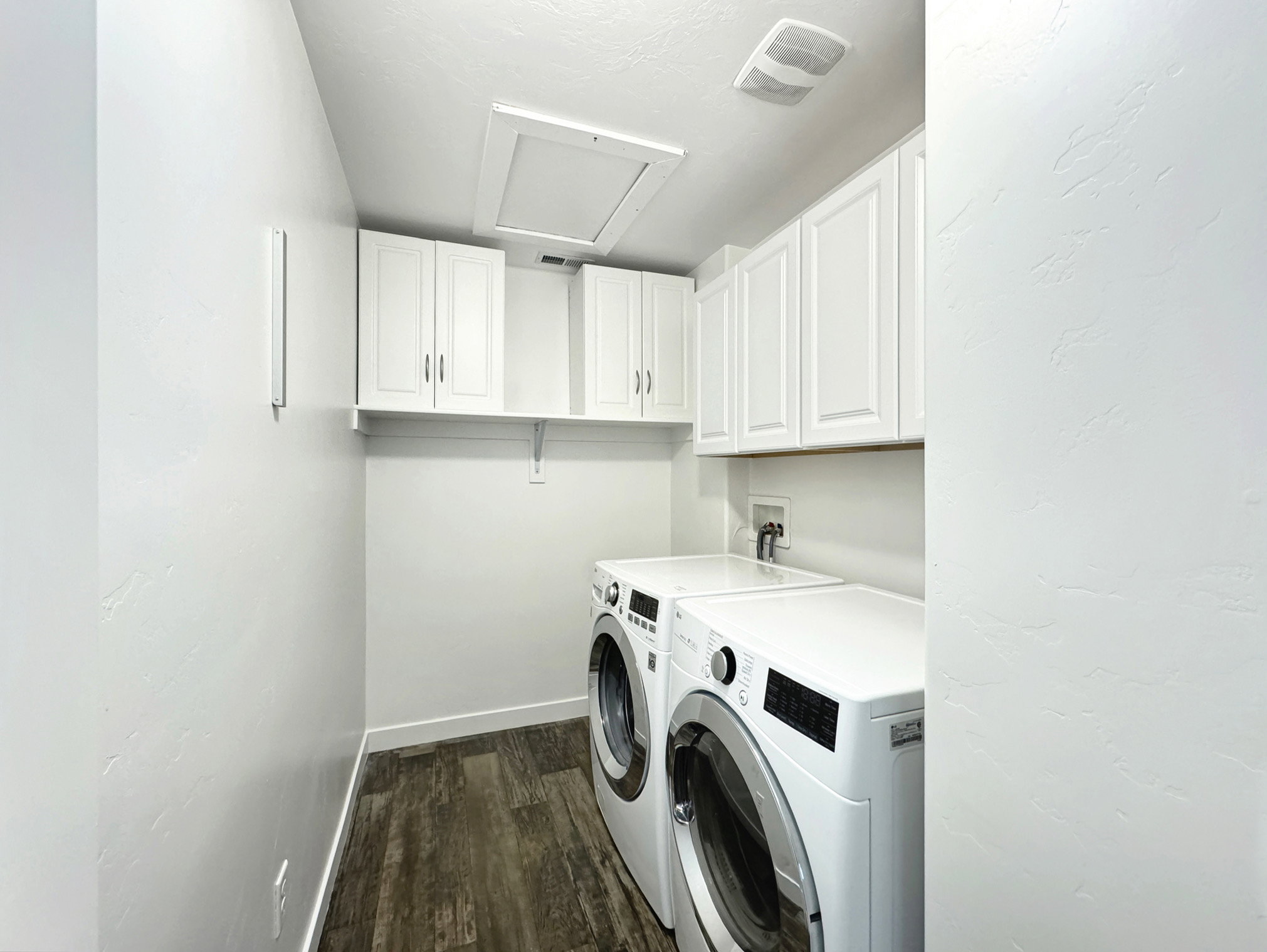 Upstairs laundry with washer and dryer.