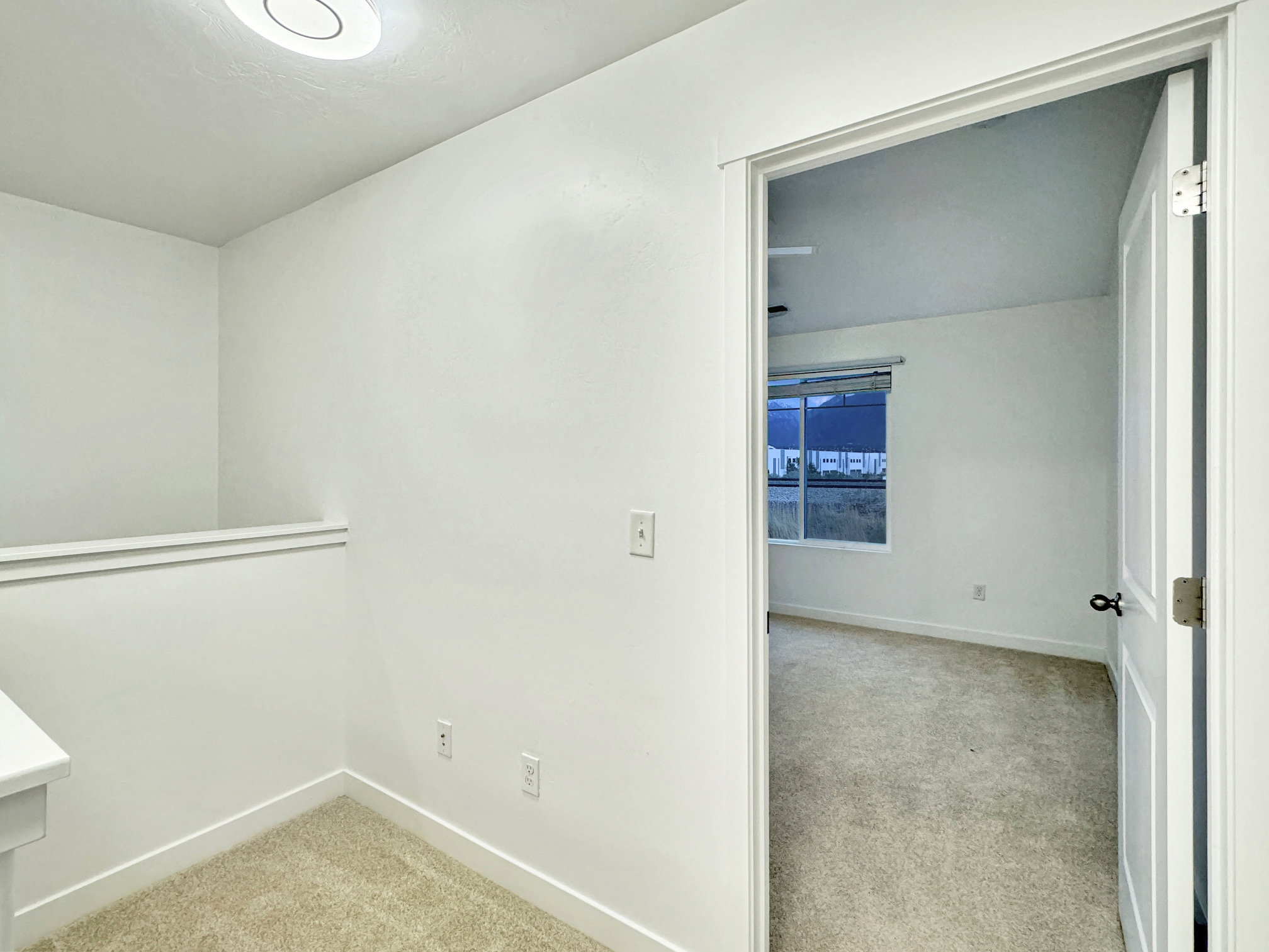 The loft area at the top of the stairs is perfect for a computer station or a sitting area.