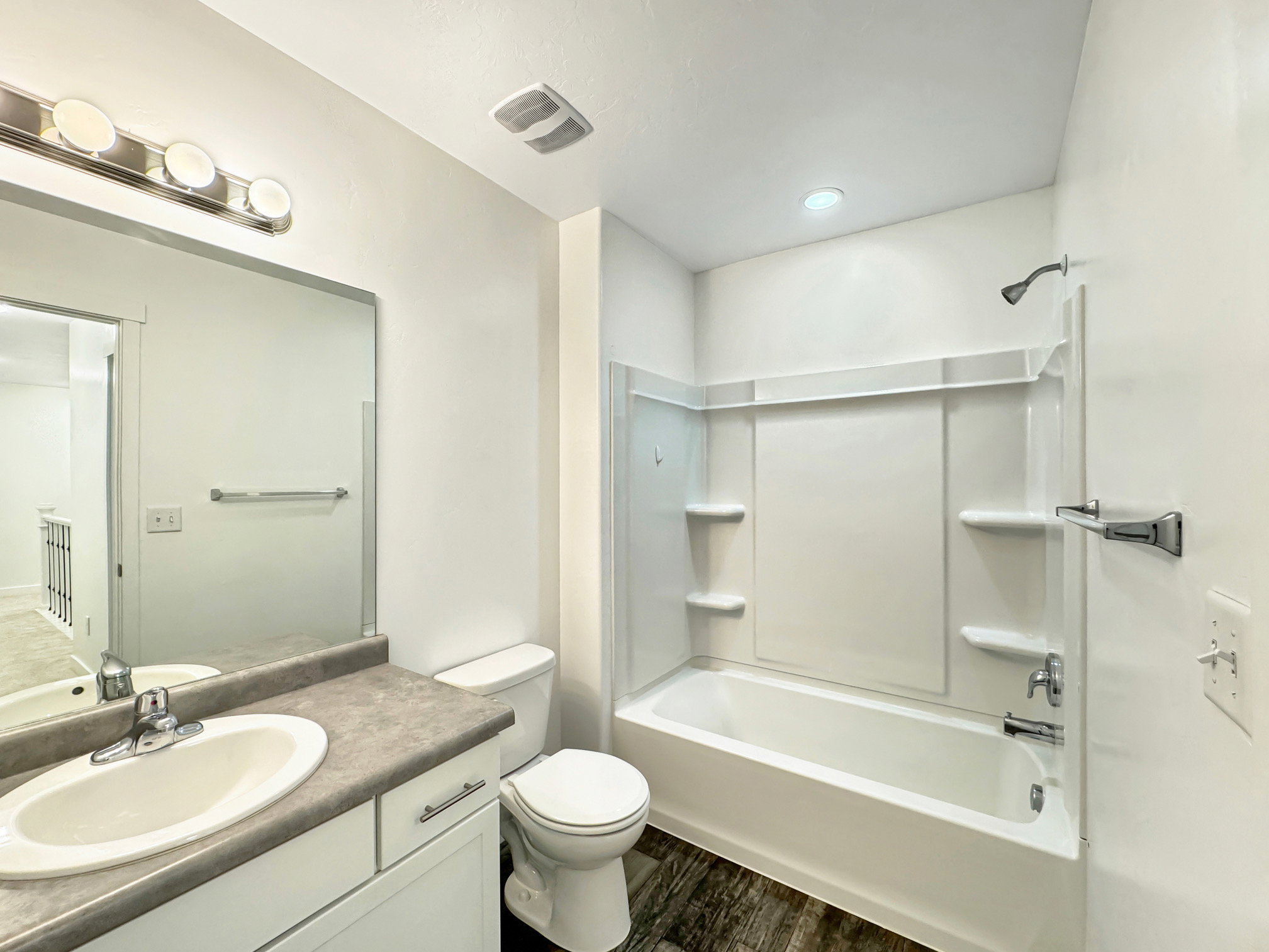 Upstairs Full bath with vanity, shower/tub combination, and dark wood-style flooring