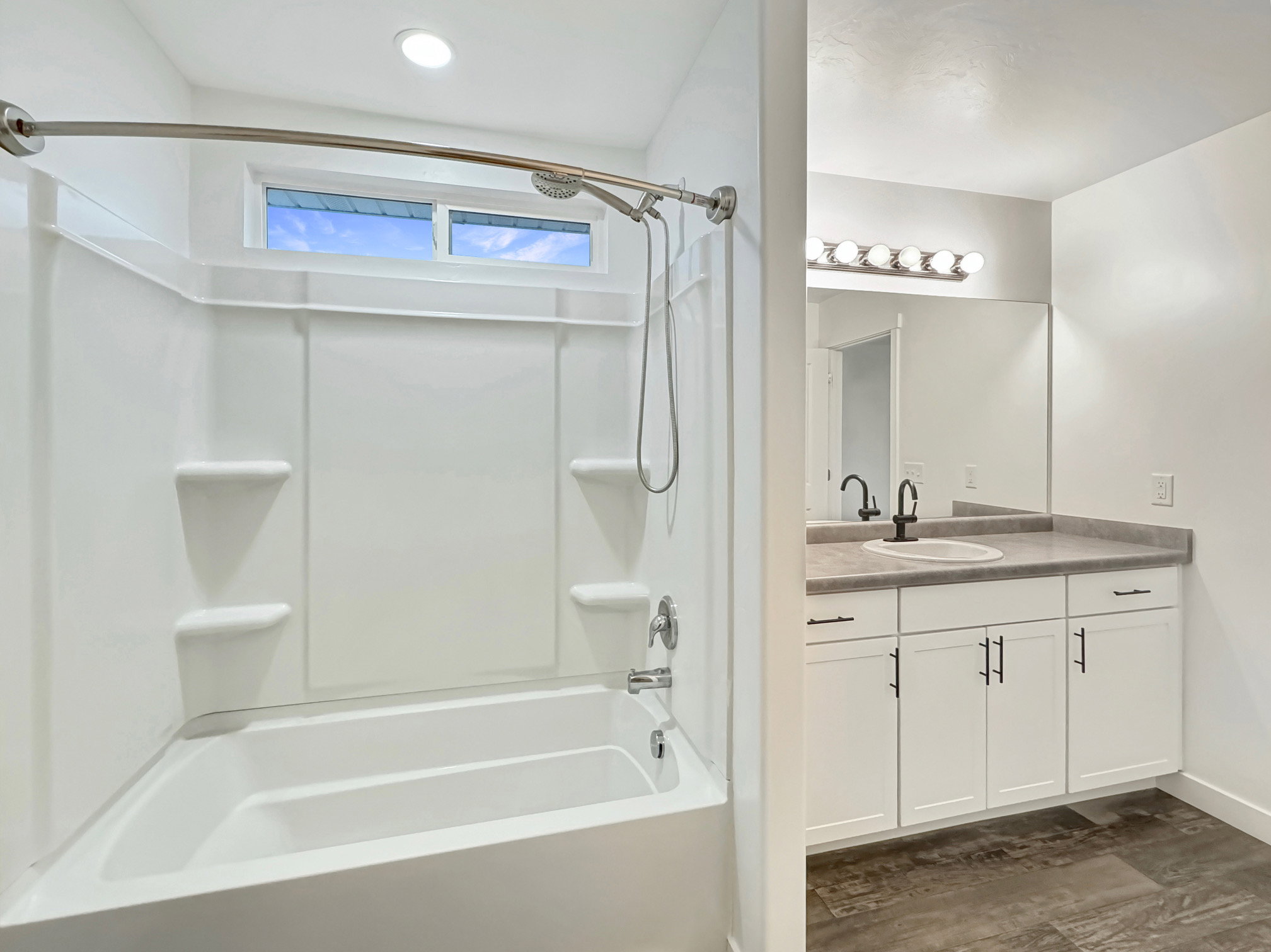 Master Bath with curved shower rod.