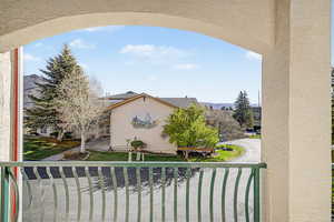 Balcony off living room with a view of the community