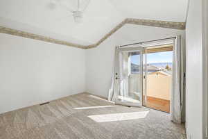 Master Ensuite with light carpet and a ceiling fan