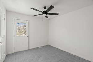 Unfurnished room with light carpet and ceiling fan