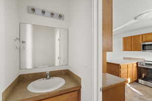 Bathroom with vanity and light tile patterned floors