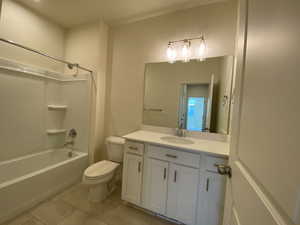 Example: Bathroom with vanity, shower / washtub combination, and light tile patterned flooring