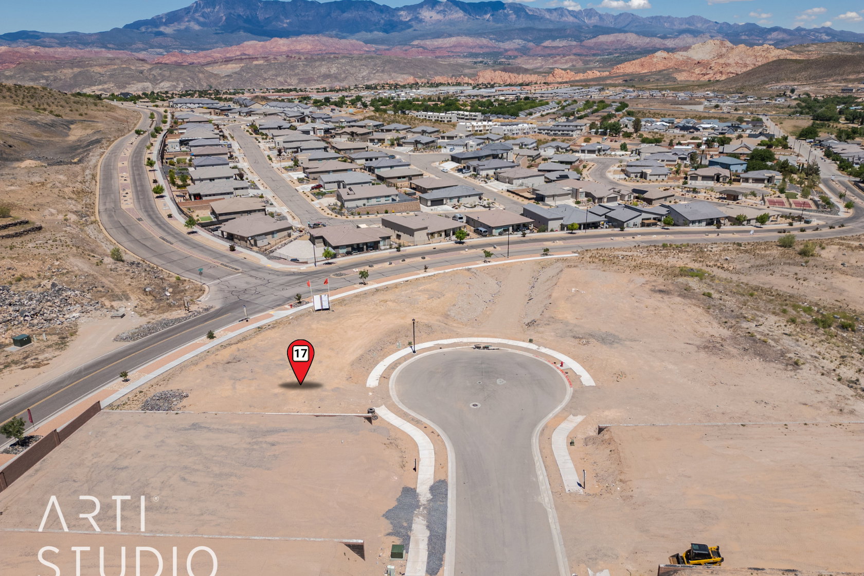 Aerial view of residential area featuring a mountain backdrop