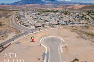 Aerial view of residential area featuring a mountain backdrop