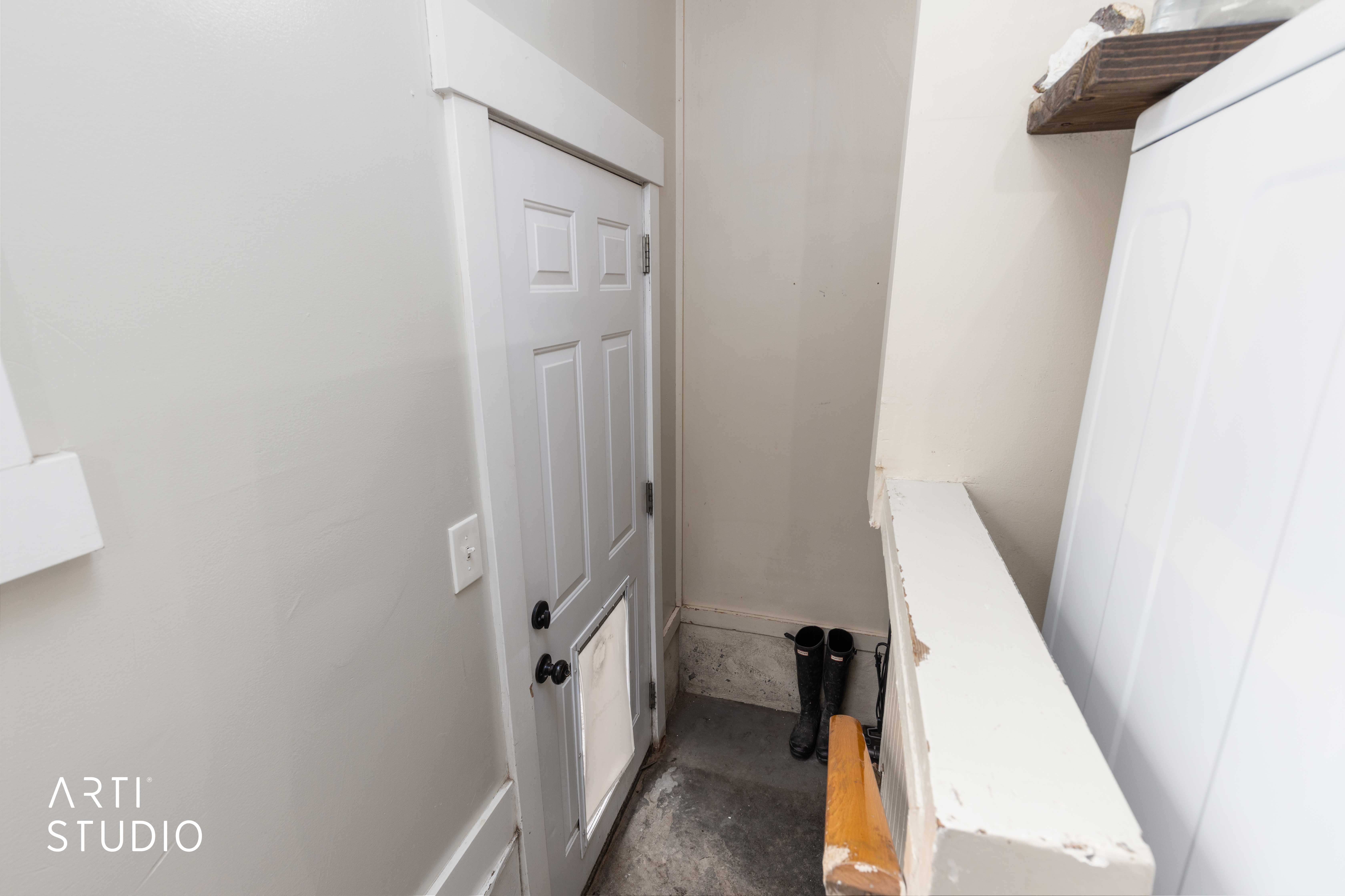 Stairs featuring washer / clothes dryer and concrete flooring