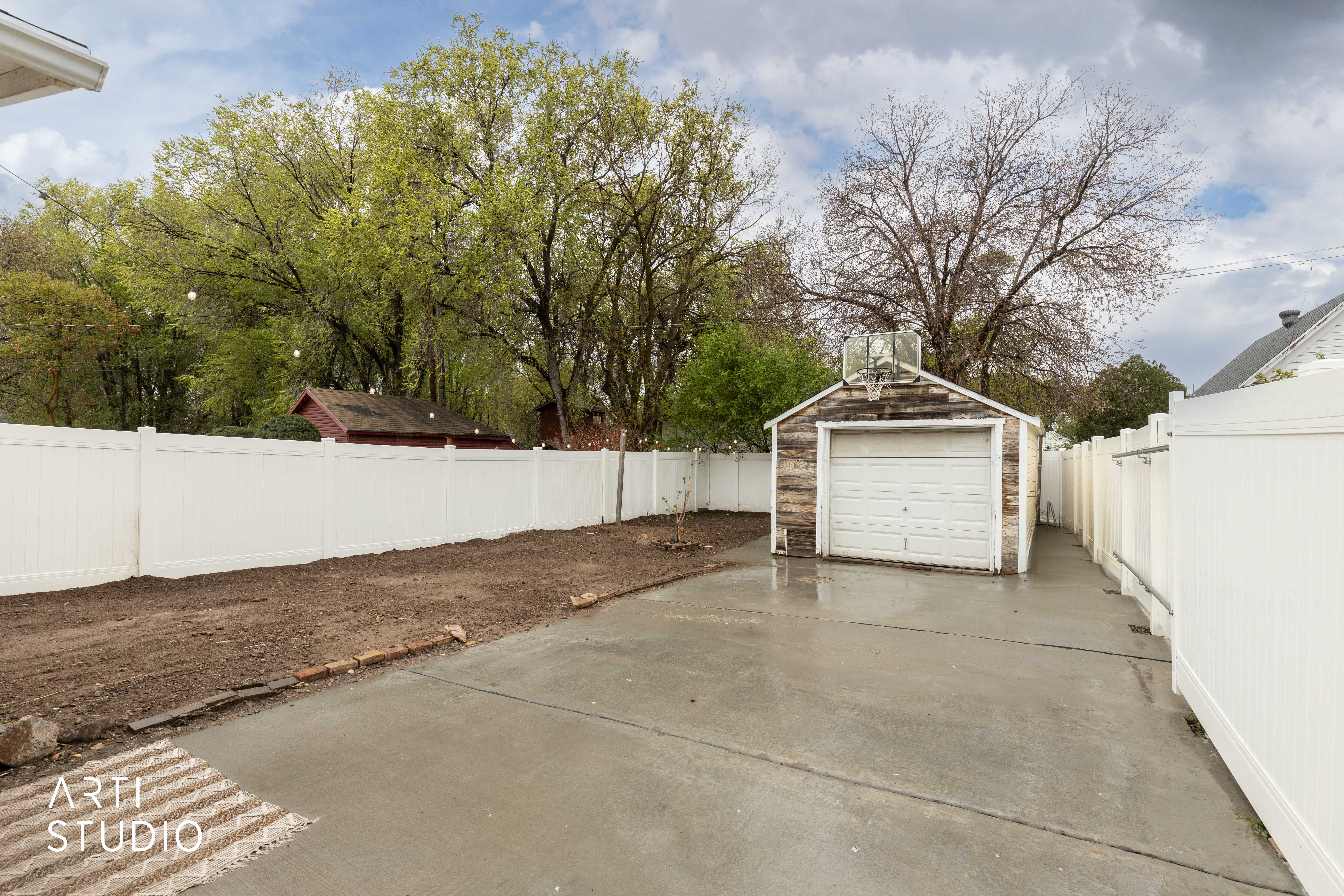 Detached garage featuring driveway