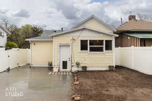 Bungalow-style home featuring a patio area and brick siding