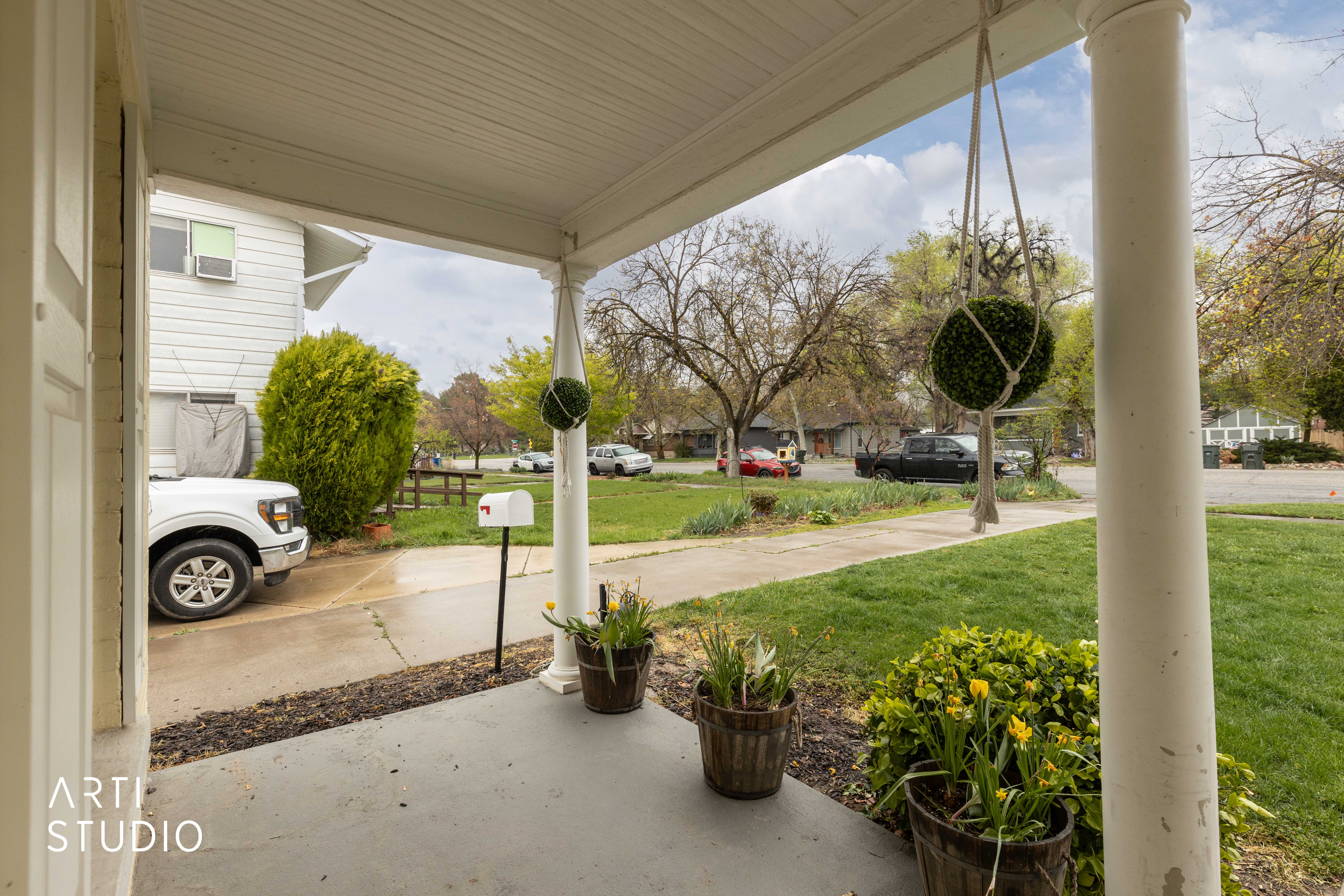 Porch featuring a yard