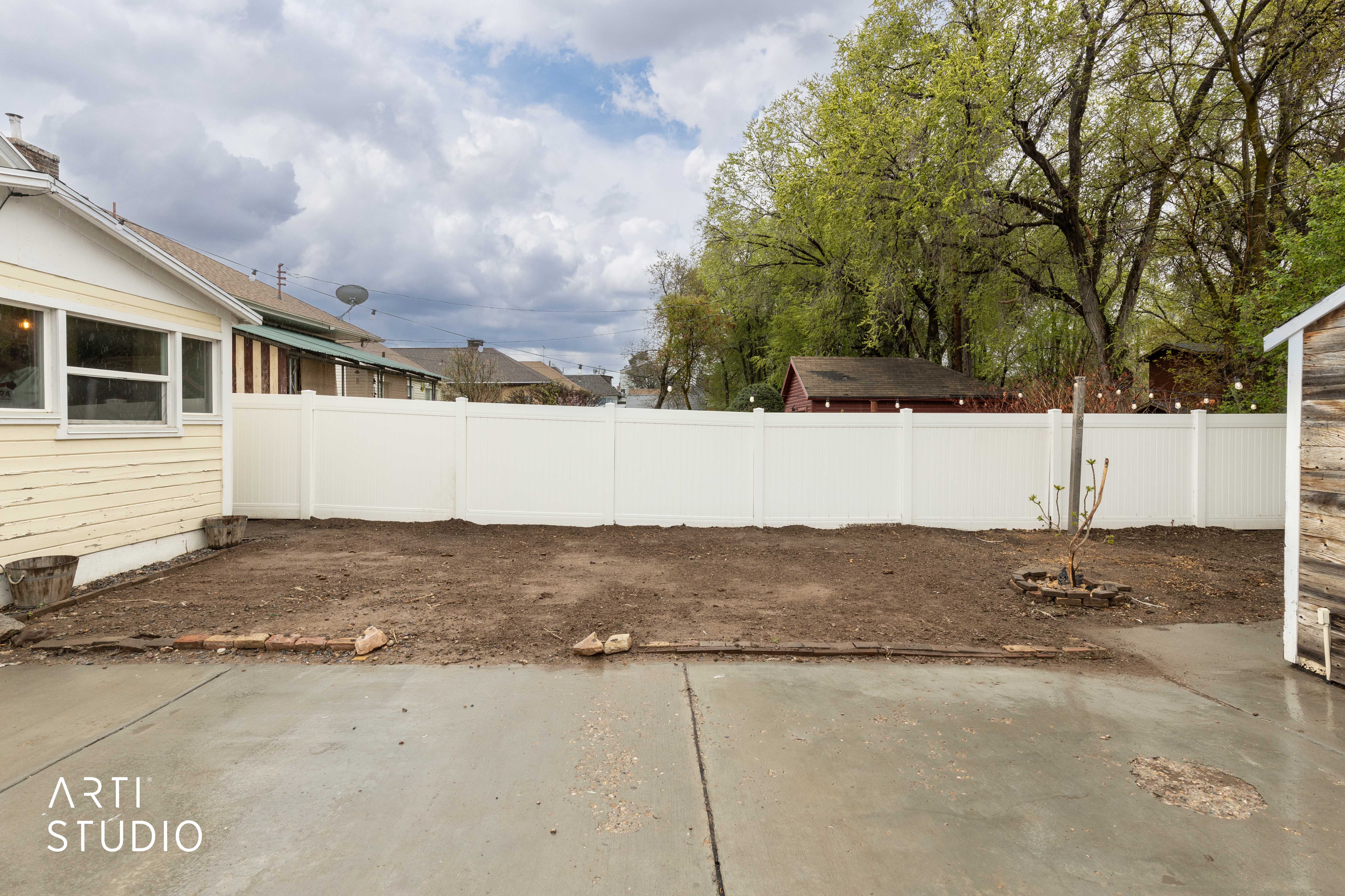 Fenced backyard featuring a patio
