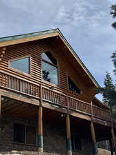 View of cabin front with deck