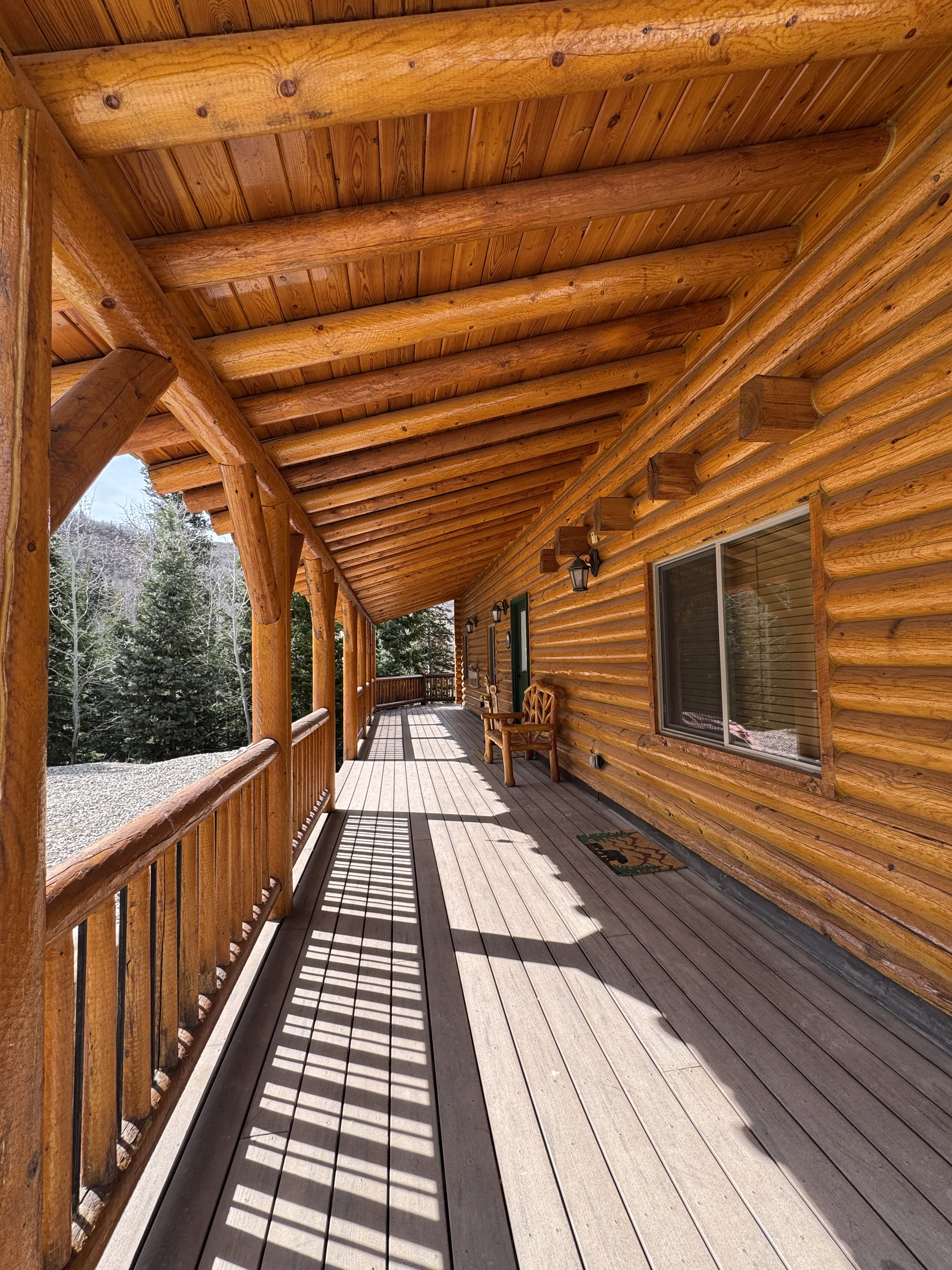 View of cabin entrance with covered deck