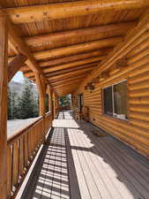 View of cabin entrance with covered deck