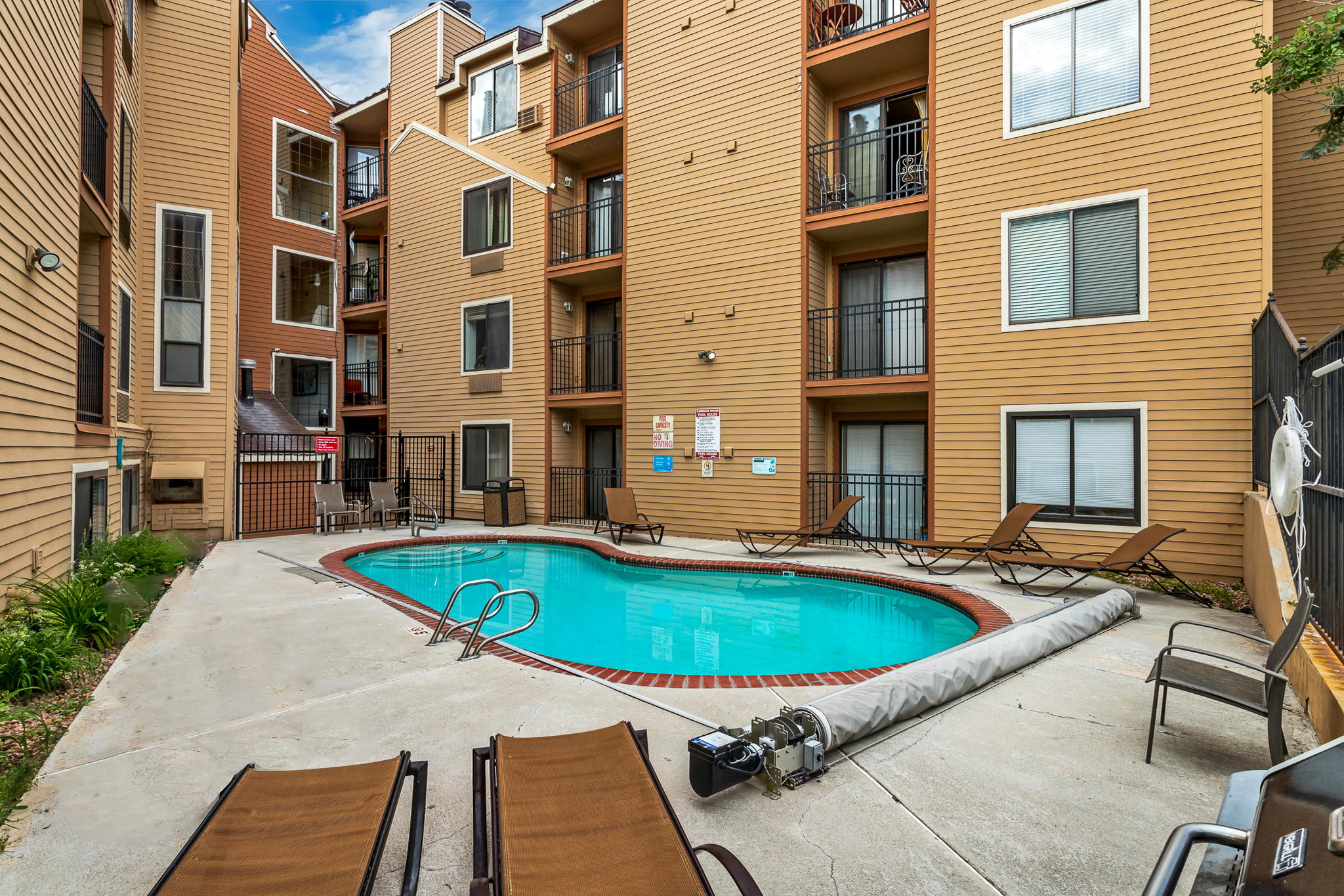 Community pool with a patio area