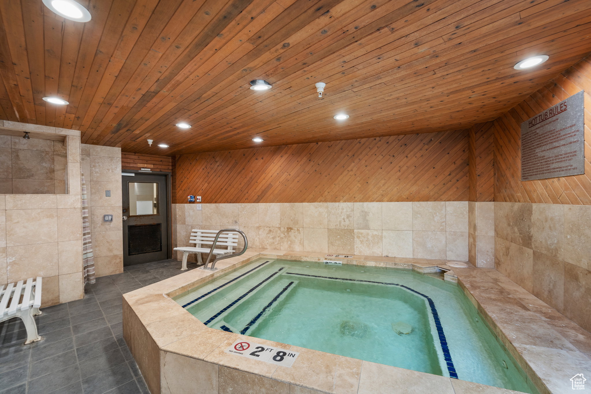 View of pool featuring a hot tub