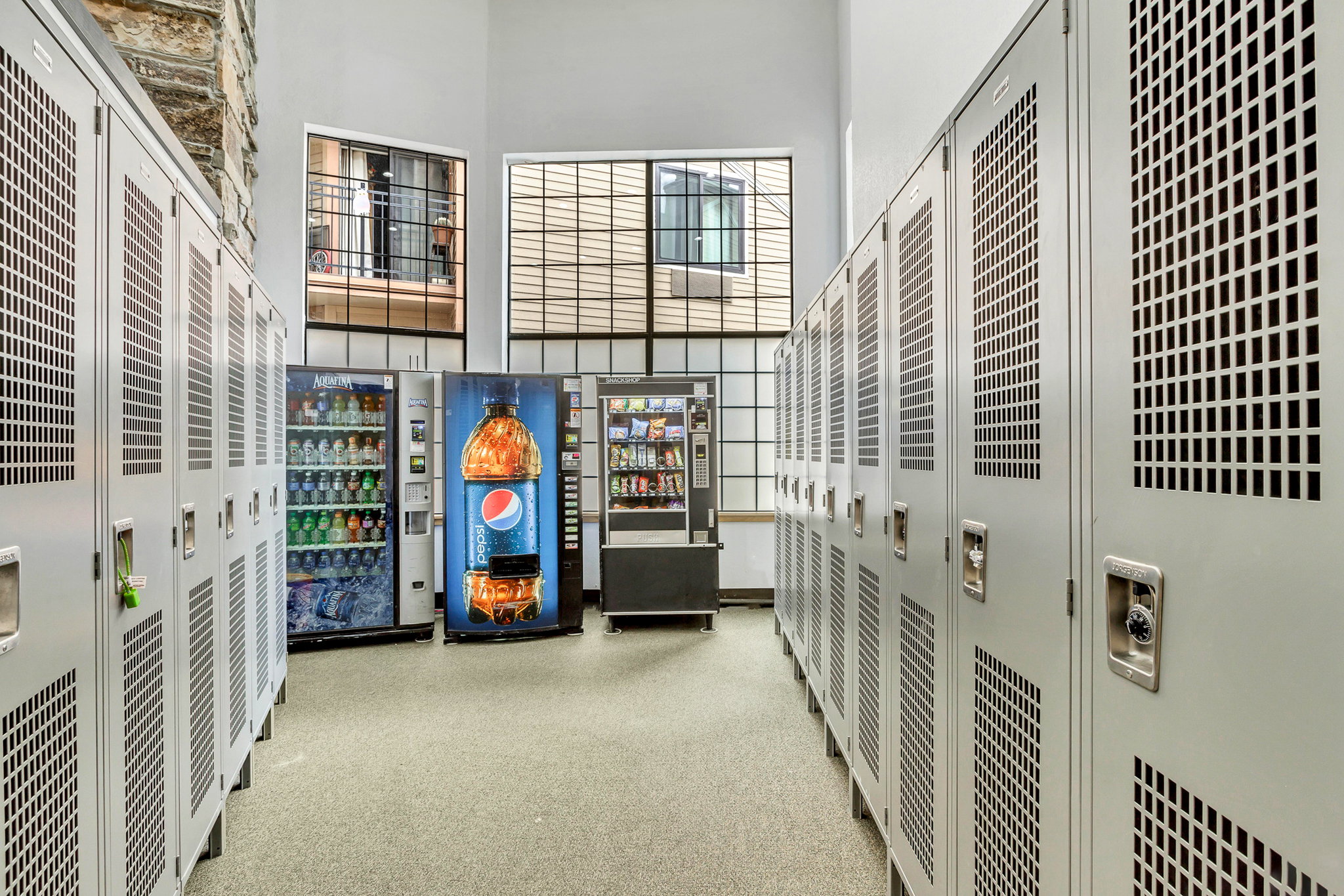 Interior space with a high ceiling and a heating unit