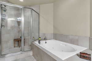 Full bathroom with a shower stall, a whirlpool tub, recessed lighting, and light tile patterned floors