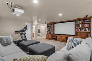 Carpeted cinema featuring recessed lighting and baseboards