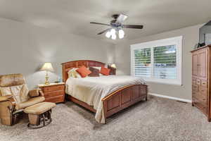 Bedroom with carpet flooring and a ceiling fan