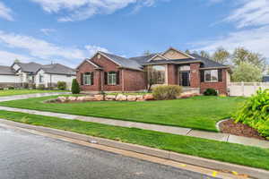 Ranch-style house with brick siding