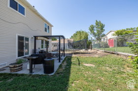 Fenced yard with a patio